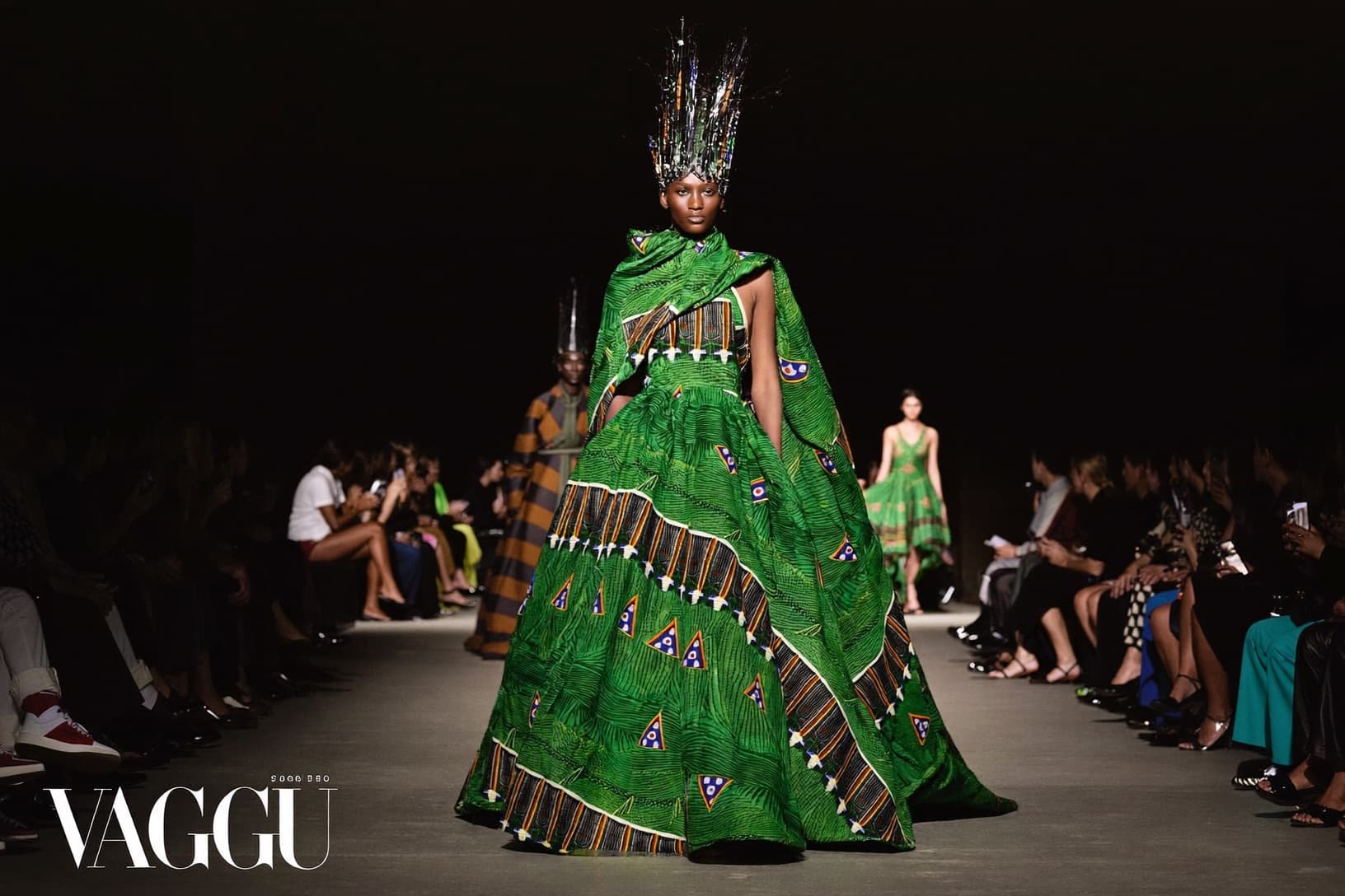 Model in an emerald Ankara gown walking a Lagos runway